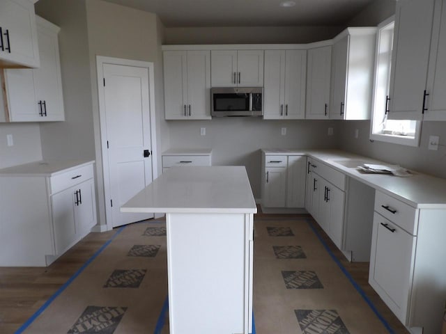 kitchen with white cabinetry and a kitchen island