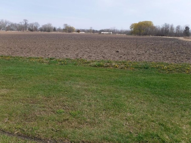 view of yard with a rural view