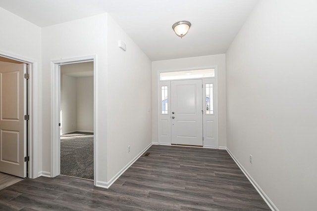 entrance foyer featuring dark wood-type flooring