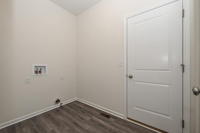 clothes washing area featuring hookup for a washing machine and dark hardwood / wood-style floors