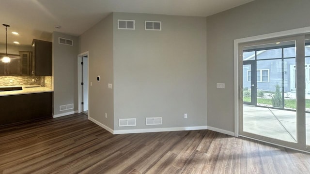 interior space with dark hardwood / wood-style flooring