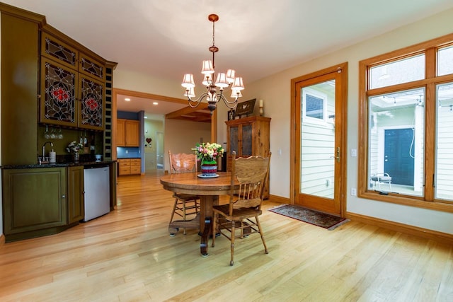 3310 Saracen Way, Verona, WI 53593 - dining room featuring light wood finished floors, bar with sink, a chandelier, and recessed lighting