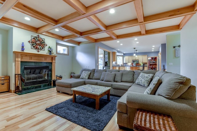 3310 Saracen Way, Verona, WI 53593 - living area with light wood-type flooring, coffered ceiling, beamed ceiling, a fireplace, and recessed lighting
