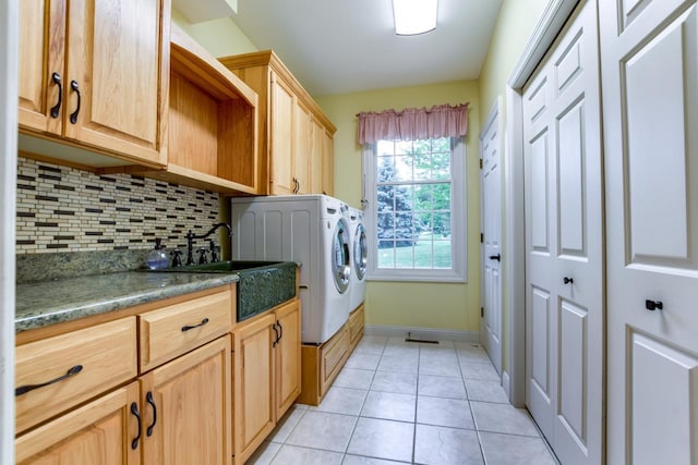 3310 Saracen Way, Verona, WI 53593 - laundry room featuring cabinet space, independent washer and dryer, and light tile patterned floors