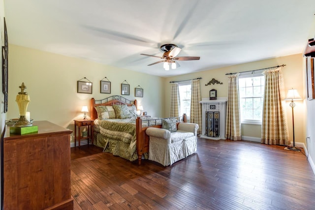 3310 Saracen Way, Verona, WI 53593 - bedroom featuring dark wood-type flooring, a fireplace, and a ceiling fan