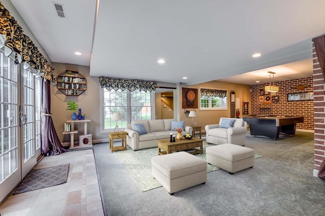 3310 Saracen Way, Verona, WI 53593 - living area featuring recessed lighting, brick wall, light tile patterned flooring, and light carpet
