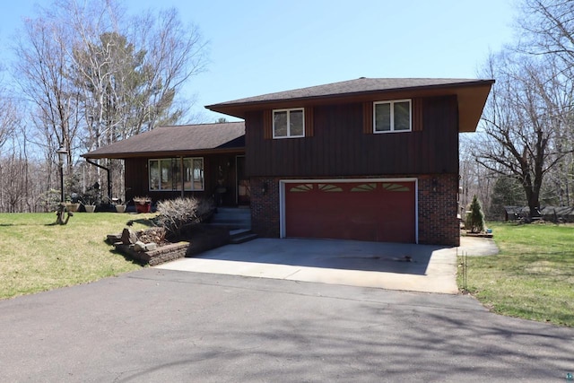 split level home featuring a garage and a front yard