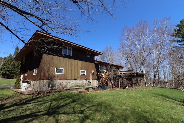 rear view of property with a yard