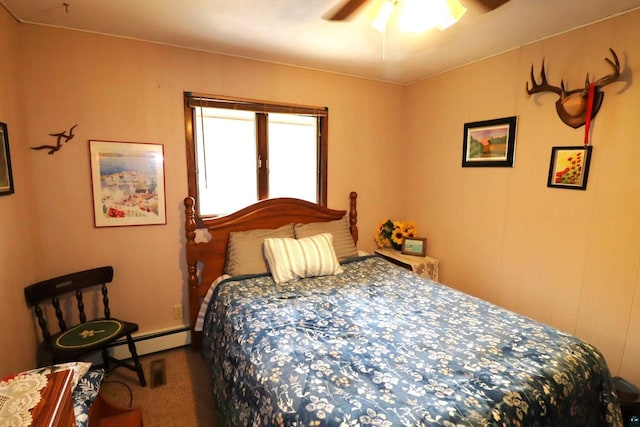 carpeted bedroom with ceiling fan and a baseboard radiator