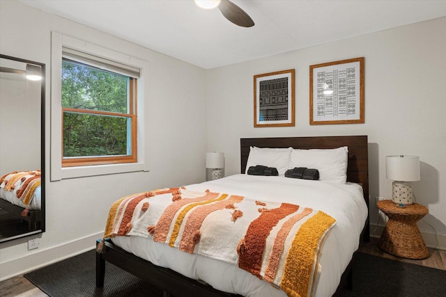 bedroom with hardwood / wood-style floors and ceiling fan