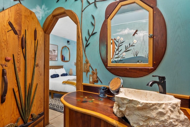 bathroom featuring tile flooring and sink