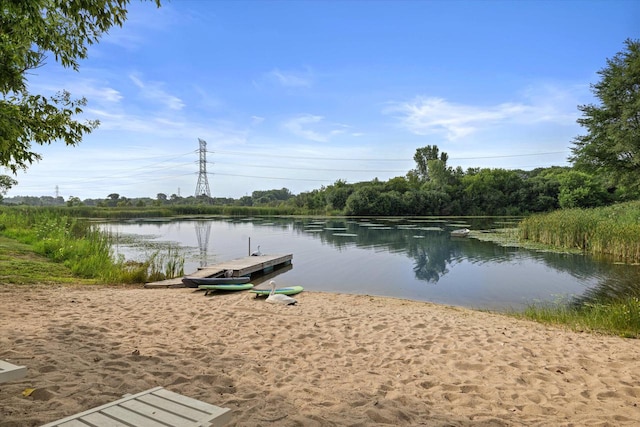 property view of water featuring a boat dock