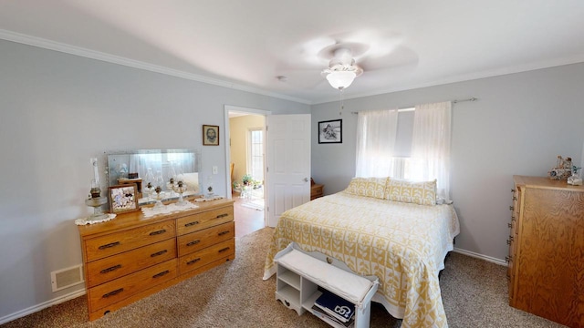 bedroom featuring ornamental molding, ceiling fan, and carpet flooring