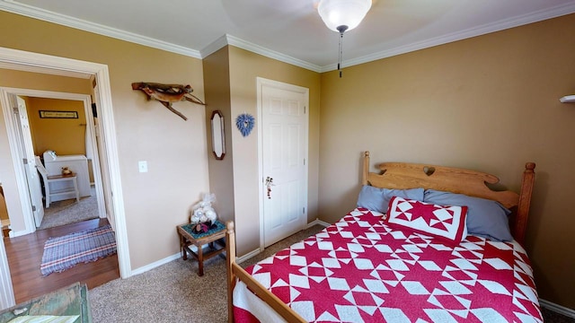 bedroom with ornamental molding, ceiling fan, and carpet