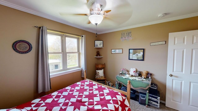 bedroom featuring ceiling fan, carpet, and ornamental molding