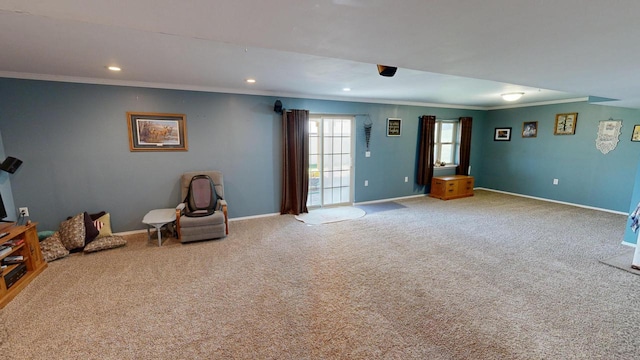 interior space with ornamental molding and carpet flooring