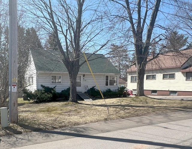 view of front of property with a shingled roof