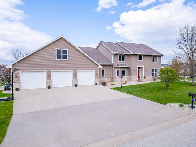 view of front of house featuring a garage and a front lawn