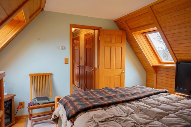 bedroom featuring lofted ceiling with skylight