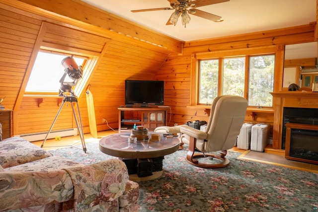 living room with wood walls, a baseboard heating unit, ceiling fan, and vaulted ceiling