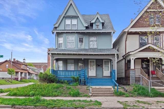 victorian house featuring covered porch