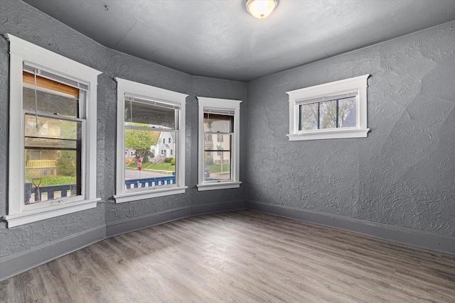 spare room with hardwood / wood-style flooring