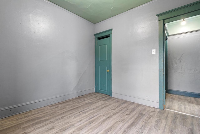 spare room featuring light wood-type flooring