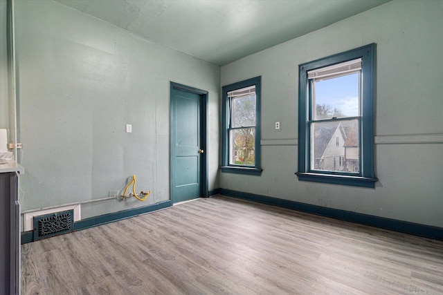 unfurnished room featuring light hardwood / wood-style flooring