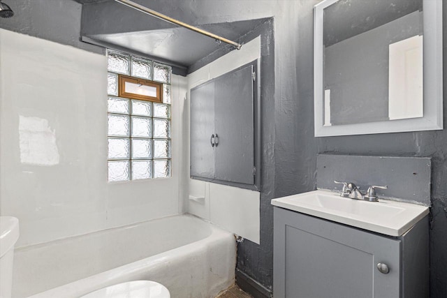 full bathroom featuring shower / bathing tub combination, vanity, and toilet