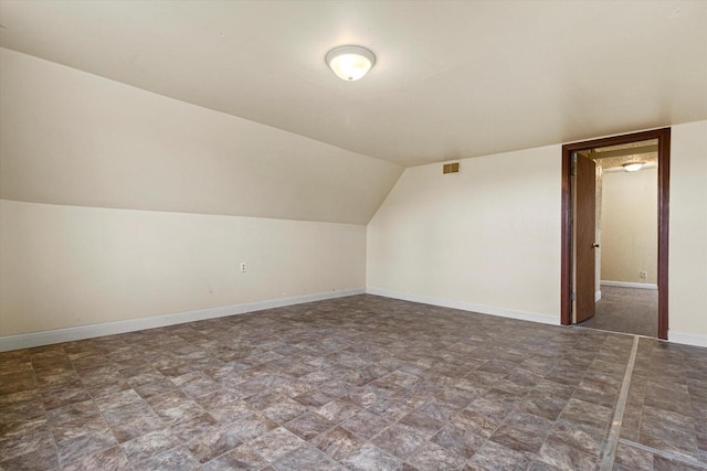 additional living space with vaulted ceiling