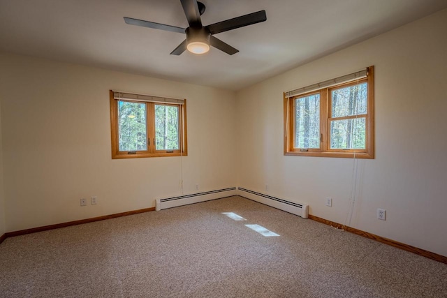 empty room with baseboard heating, carpet, and ceiling fan