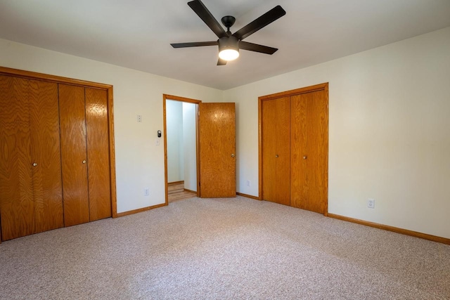 unfurnished bedroom with ceiling fan and carpet floors