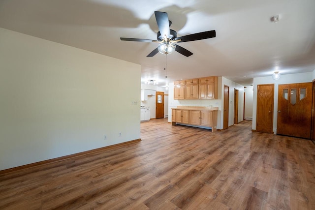 unfurnished bedroom with wood-type flooring and ceiling fan