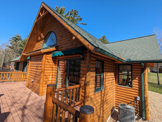 wooden deck with central air condition unit