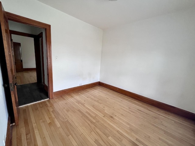 unfurnished room featuring light hardwood / wood-style flooring