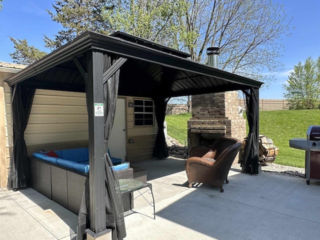 view of patio featuring an outdoor fireplace