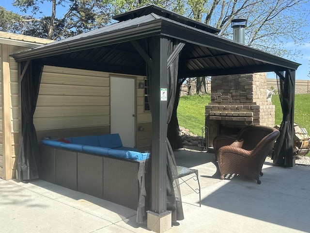 view of terrace featuring an outdoor living space with a fireplace