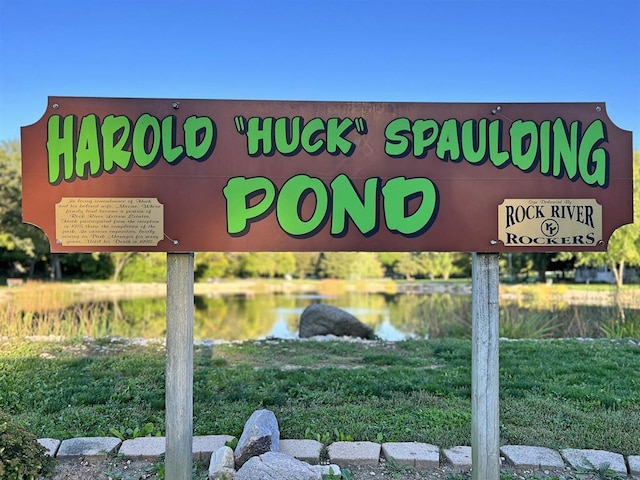 community sign with a water view