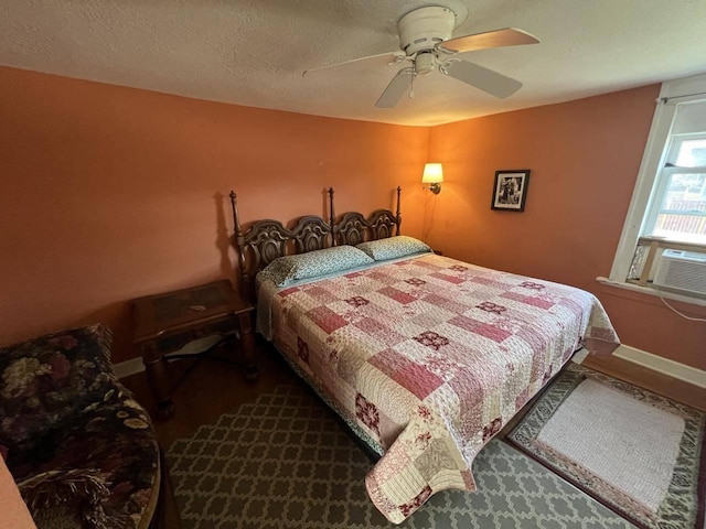 bedroom featuring ceiling fan and a textured ceiling