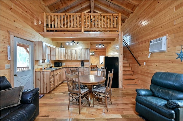 dining space with wood ceiling, light hardwood / wood-style flooring, and sink