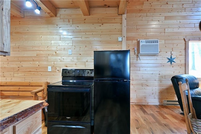 kitchen featuring light hardwood / wood-style floors, beam ceiling, black appliances, and wood walls