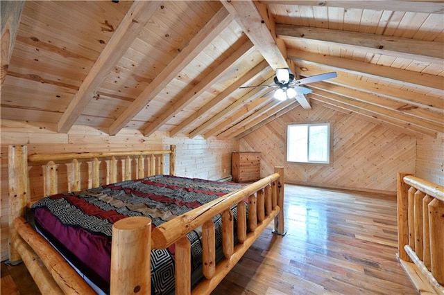 bedroom with wood walls, wood-type flooring, lofted ceiling with beams, and wooden ceiling