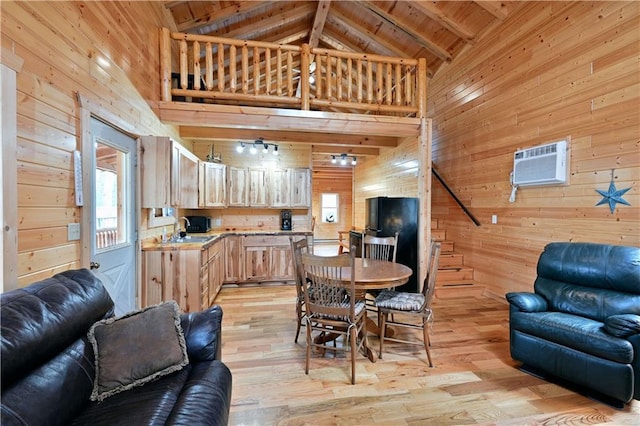 living room with beamed ceiling, a wall unit AC, high vaulted ceiling, light wood-type flooring, and wooden walls