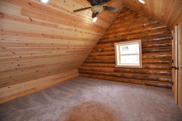 bonus room with lofted ceiling, rustic walls, and wooden ceiling