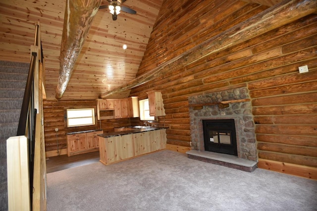 unfurnished living room with a fireplace, wooden ceiling, rustic walls, ceiling fan, and light colored carpet