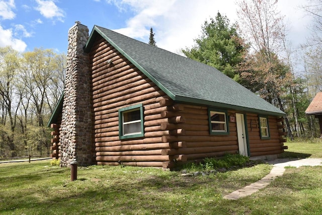 view of side of home with a yard