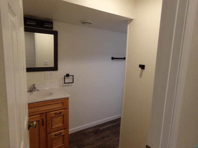 bathroom with hardwood / wood-style flooring and vanity