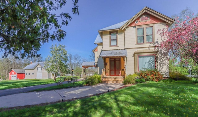 victorian home featuring a front yard