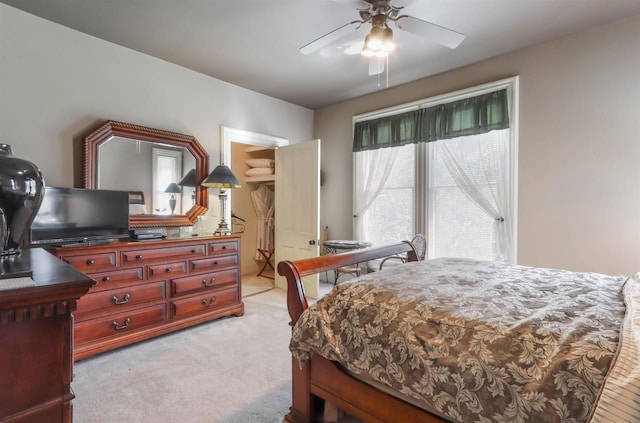 bedroom with light colored carpet and ceiling fan