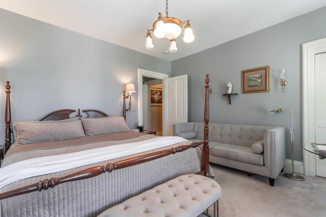 carpeted bedroom featuring a notable chandelier